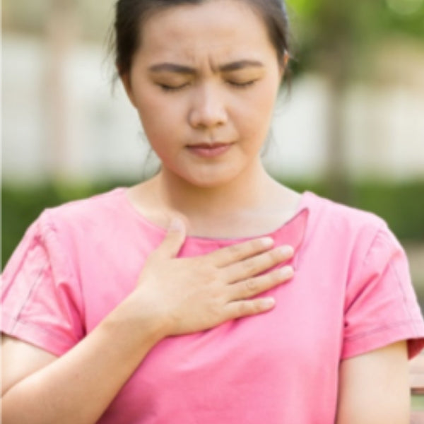 Woman suffering from acid reflux