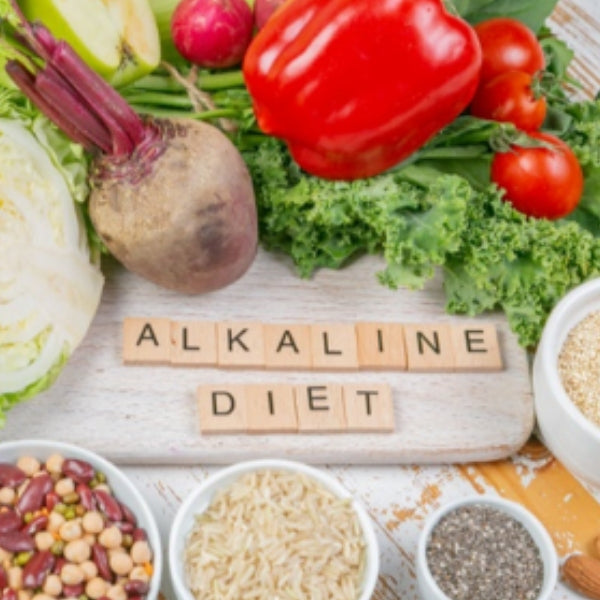 Alkaline diet guide with fresh fruits, vegetables, and plant-based foods
