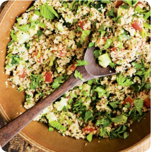 alkaline spinach recipe with fresh herbs, lemon, and chickpeas