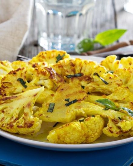 Alkaline diet recipe for cauliflower steaks with ginger, turmeric, and cumin—anti-inflammatory, hearty, and steak-like without the acid.