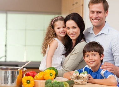 healthy family preparing food using eating out tips to get off your acid