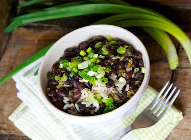 quinoa burrito bowl with adzuki beans, avocado, lime, and cilantro